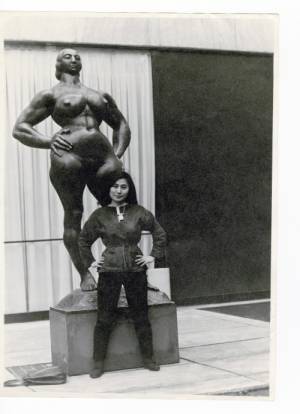 Yoko Ono with Standing Woman (1932) by Gaston Lachaise, The Museum of Modern Art Sculpture Garden, New York, c1960–61. Photograph: Minoru Niizuma. © Minoru Niizuma. Courtesy Lenono Photo Archive, New York.